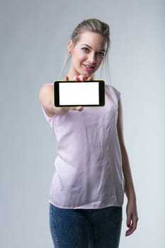 Tech-savvy woman offers a digital device, inviting technological engagement