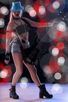 Dazzling lights and music gear create a vivid rock concert atmosphere
