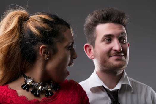 Shocked young black woman catches her man looking away jealousy and disbelief in her eyes