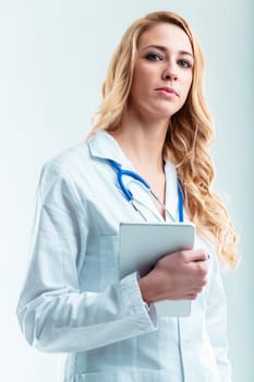 Doctor with digital device in copyspace, useful for telehealth, efficient consultation, patient information handling