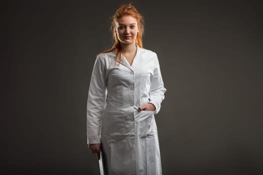 Young medical staff member, her red hair denoting her distinct presence, prepares for a day of digital healthcare