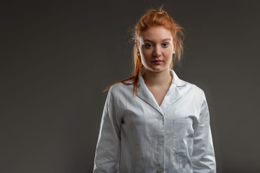 scientist with a vibrant red mane dons the white coat, symbolizing a blend of tradition and innovation in research
