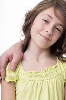 Girl in green, relying on dad's barely visible figure, exemplifies parent-child bond