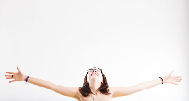 The joy of openness displayed by a woman with arms stretched and a beaming face