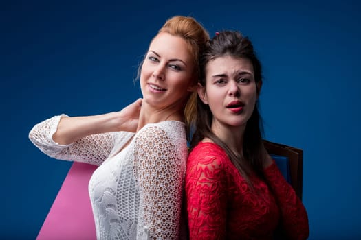 Expert in style and economy, two young women question traditional shopping methods