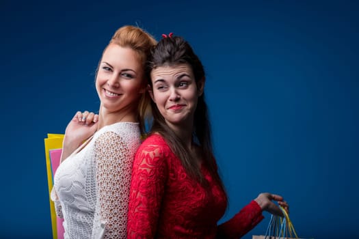 Ready to advise on shopping, two young women exhibit skepticism and expertise