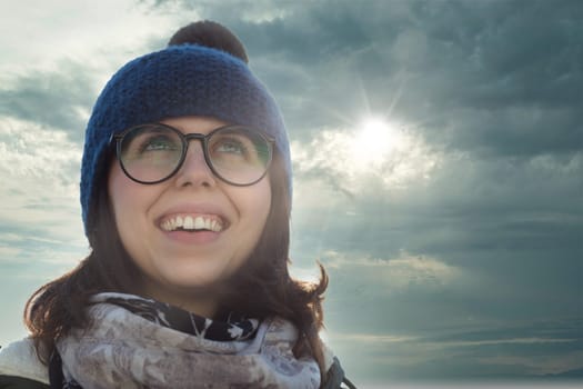 Winter accessories paired with a sunny smile give off a feeling of contentment and warmth