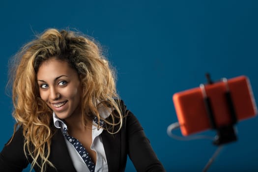With a smart jacket and an engaging smile, she bridges the gap between professional and playful