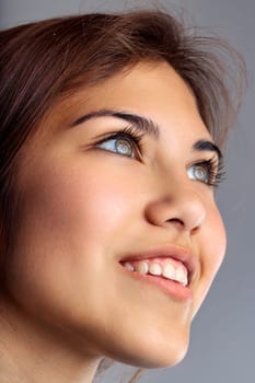 Close-up of a woman with hopeful eyes, capturing the essence of optimistic anticipation