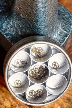 Detailed focus on watch components in a steampunk, vintage setting. Wrist and pocket watches manifest the blend of technology, aesthetics, and skill in watchmaking