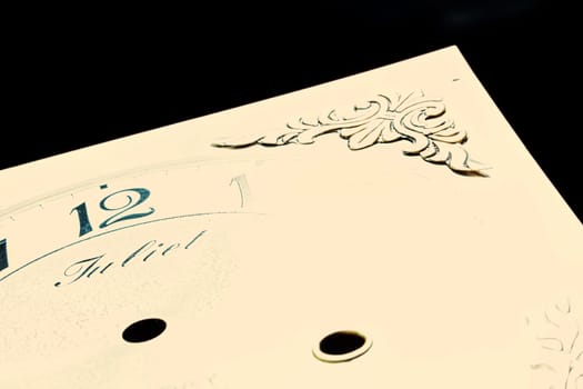 Watch face showcases artistry with floral engraving and prominent numerals against stark contrast