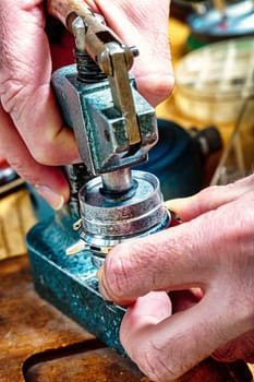 Wrist and pocket watches, gears, springs on an artisan's table: a showcase of precise craftsmanship. Steampunk atmosphere with a retro touch enhances the blend of art, skill, and technology