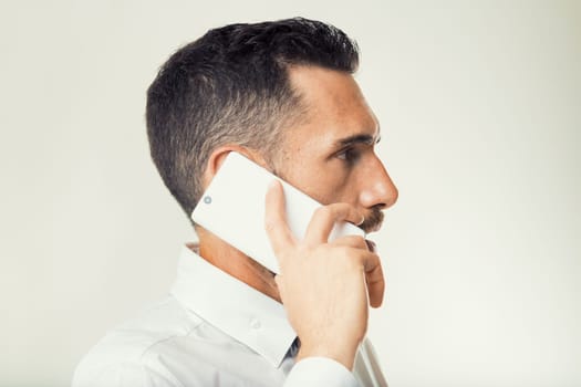 Office professional navigates a challenging conversation, his demeanor showing determination to resolve issues