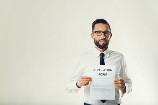 Career-driven professional confidently displays an application, signaling readiness for advancement