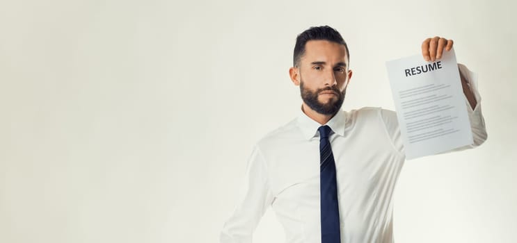 Confident professional showcases his resume, indicating career advancement and opportunities