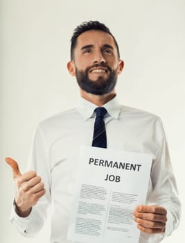 Jubilant professional celebrates securing a permanent job position, giving a thumbs-up