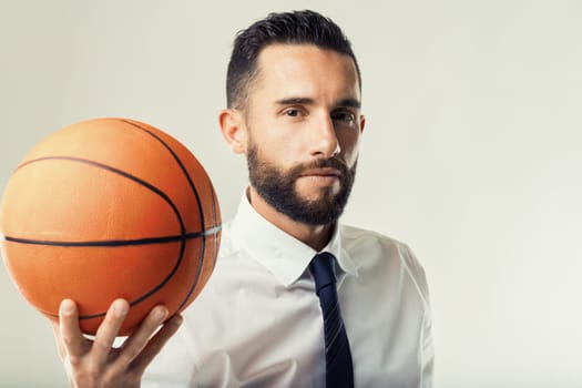 Professional in a white shirt and tie exemplifies leadership and teamwork through sports