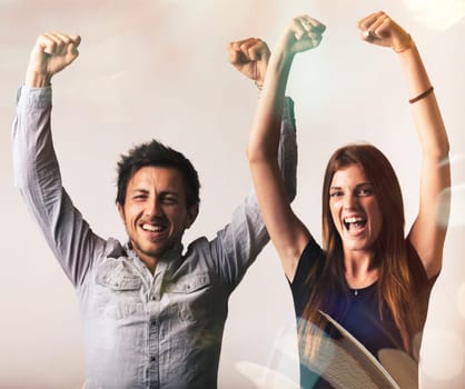 A man and woman rejoice in triumph, laughing, shouting joyfully with arms aloft. They celebrate luck's turn in a burst of happiness, embodying maximum positivity, the ultimate joy of living. Yes!!!