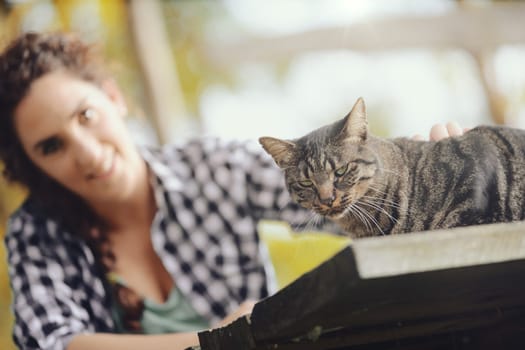 We all know who's in charge in the world, the cat thinks. The same thing the woman thinks. Both do not know that in coma to the food chain are bacteria.