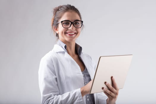 woman, lab coat, glasses, digital tablet, smiling, positive news, scientific, technology, modern technology, data analysis, research, knowledge, expertise, precision, technical skills, high-tech tools