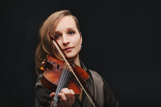 The artist's connection with her violin shines through, showcasing the intimate bond between musician and instrument