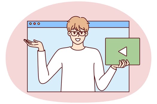 Man with play button in hand looks out of web browser window. Young guy in white t-shirt recommends that subscribe to video blog or do business promotion on social networks