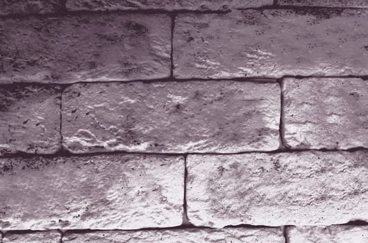 An old monochrome wall of blocks in close-up