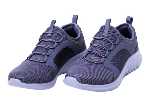 Closeup of a pair of modern silver gray sneakers or sports shoes isolated on a white background. Elegant and trendy mans shoes. Macro.