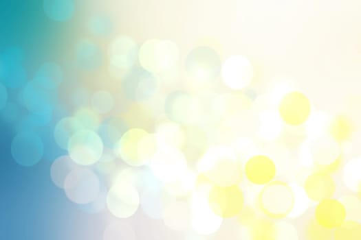 Abstract gradient light blue turquoise yellow green shiny blurred background texture with circular bokeh lights. Beautiful fresh backdrop. Space for design.