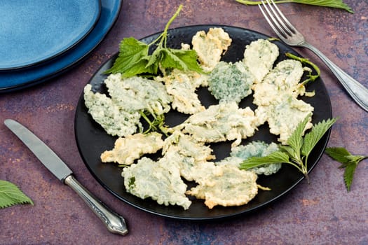 Breaded nettle or battered nettle. Spring greens appetizer. German cuisine. Copy space.