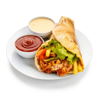 Delectable flavors of a shawarma platter, featuring a symphony of marinated meat, crispy fries, melted cheese, tangy pickles, fresh tomatoes, leafy greens, and a drizzle of delectable sauces wrapped in soft pita bread