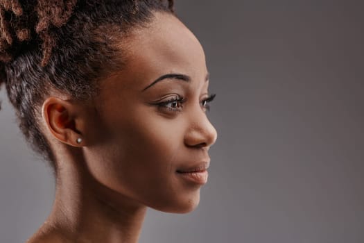 Contemplative gaze of an young black beautiful woman, lost in thought