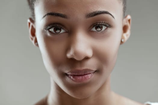 Intimate portrait showcasing a woman's faint smile and piercing gaze