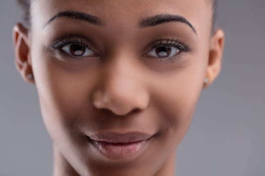 Young woman's face with delicate features and a hint of a smile
