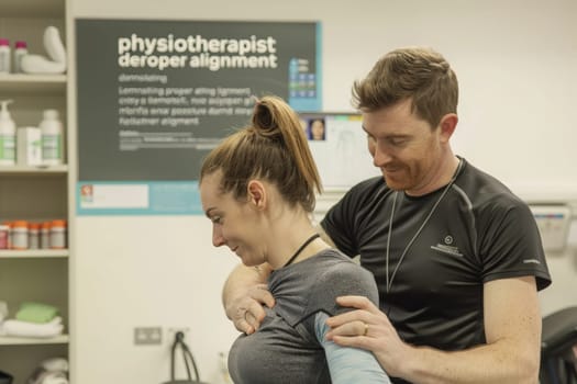 A focused therapist instructs on posture correction, ensuring the patients spinal health is a priority.