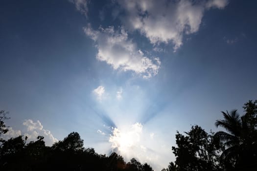 Pretty huge white clouds in the blue sky background.