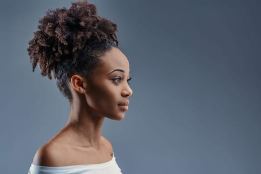 The serene profile of a young Black woman, elegance in her simplicity