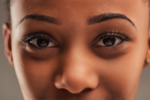 Intense close-up of a woman's eyes, detailed with perfectly applied makeup, showcasing depth and emotion