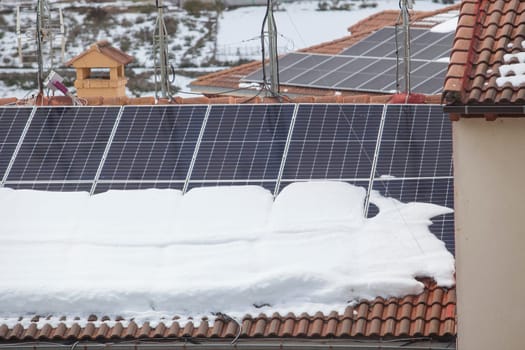 Roof solar panels covered with snow. Solar panels after snowstorm