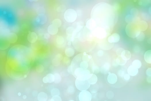 Abstract gradient light blue turquoise yellow green shiny blurred background texture with circular bokeh lights. Beautiful fresh backdrop. Space for design.