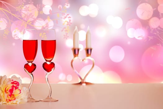 Happy Valentines or Mothers Day template. Decorative composition of glasses of champagner, flowers, candles on table over abstract spring background. Card design.