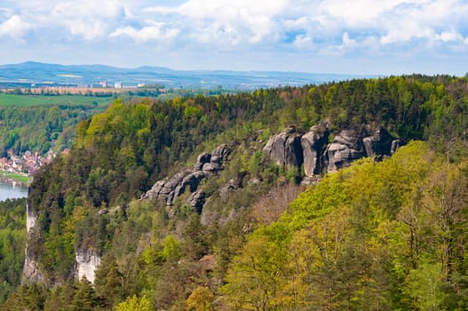 Beautiful summer view of Elbe river from Bastei view pont. Colorful morning scene of Saxon Switzerland national park, Germany, Europe. Splendid landscape of Sandstone Mountains, Saxony.