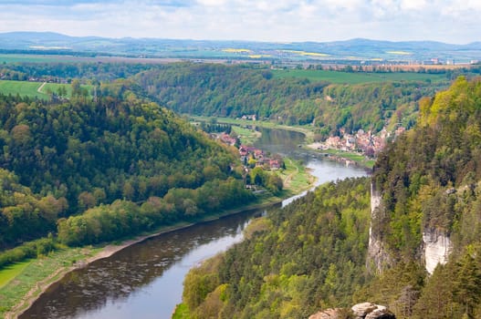 Beautiful summer view of Elbe river from Bastei view pont. Colorful morning scene of Saxon Switzerland national park, Germany, Europe. Splendid landscape of Sandstone Mountains, Saxony.