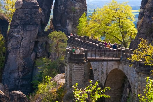 Saxon Switzerland National Park, Germany - April 19, 2124: The people going at Bastei bridge at Saxon Switzerland National Park