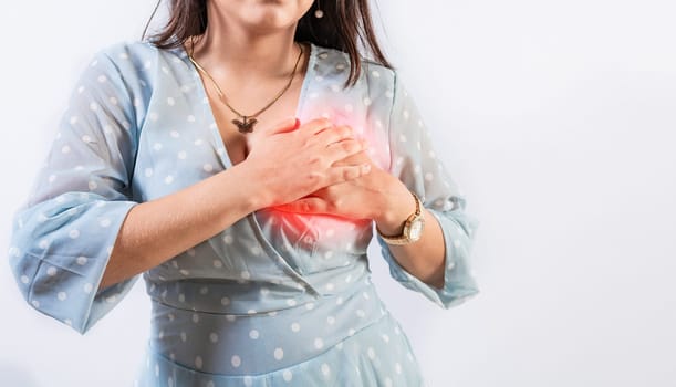 Unrecognizable woman with chest pain isolated. Girl with heart pain on isolated background. Concept of people with heart problems