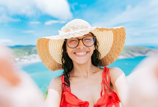 Beautiful tourist girl taking a selfie on the beach. Happy tourist girl taking a selfie on the beach of San Juan del Sur