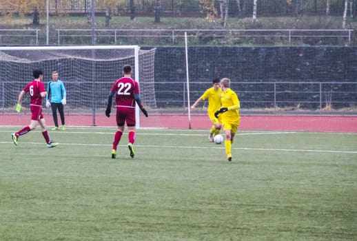 Russia, Volgodonsk - may 17, 2015: Football game. Training matches junior teams and fans