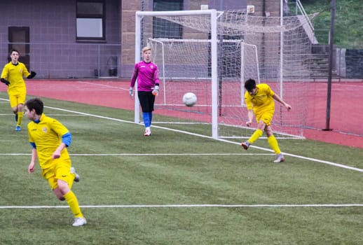 Russia, Volgodonsk - may 17, 2015: Football game. Training matches junior teams and fans