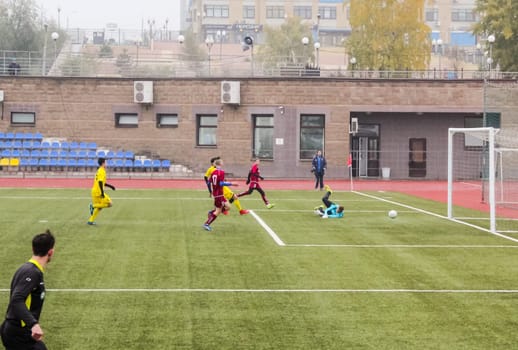 Russia, Volgodonsk - may 17, 2015: Football game. Training matches junior teams and fans