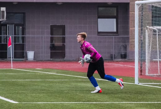Russia, Volgodonsk - may 17, 2015: Football game. Training matches junior teams and fans